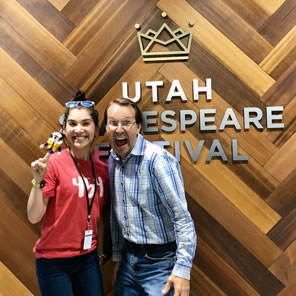 Photo of Dickson and Bahr in fron of Utah Shakespeare Festival wall